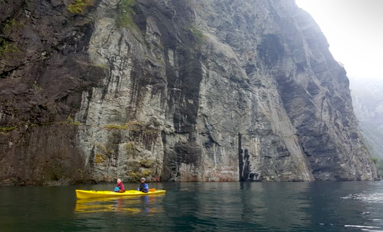 Sea kayaking in fjord