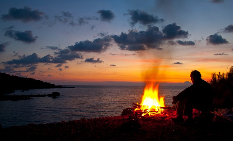 Beach campfire at sunset