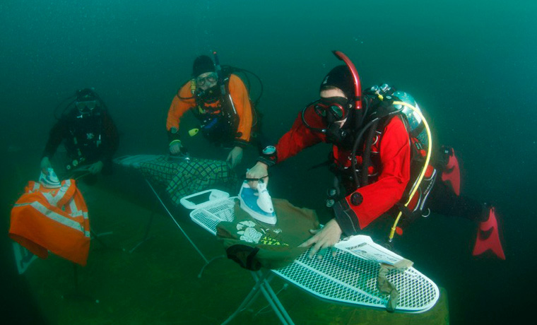 Extreme ironing scuba divers