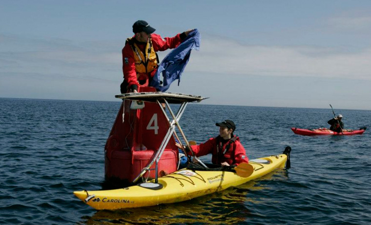 Extreme ironing sea kayaking
