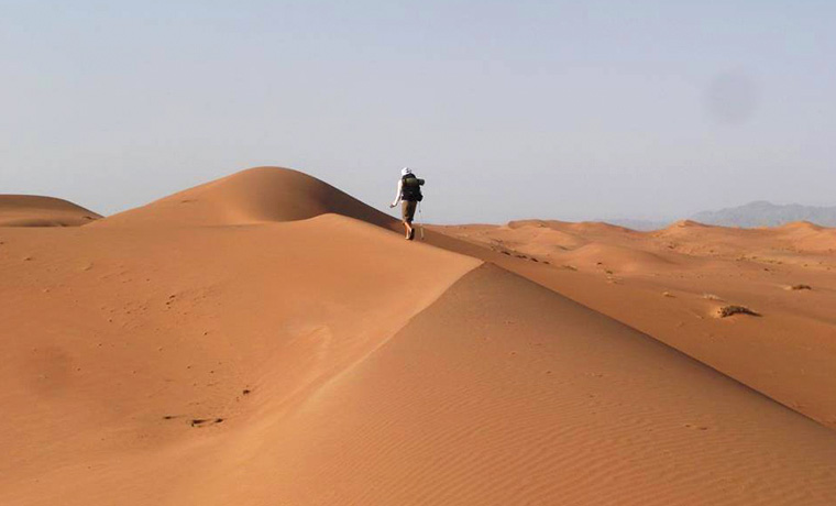 Walking on desert sand dunes