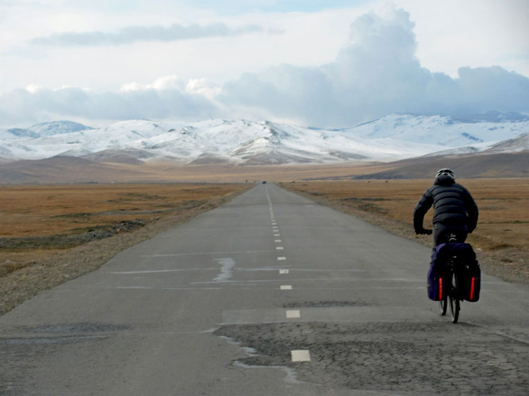 Cycler in Mongolian mountains