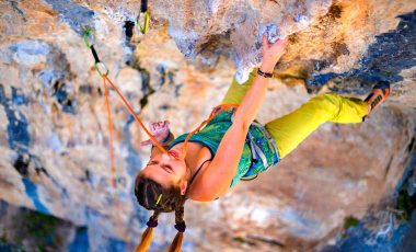 Girl sport climbing on rock