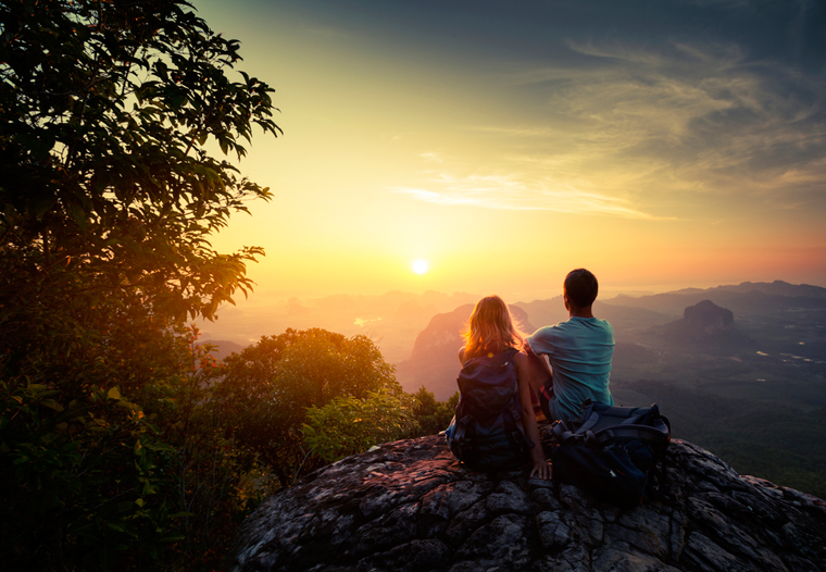Couple sitting watching the sunrise