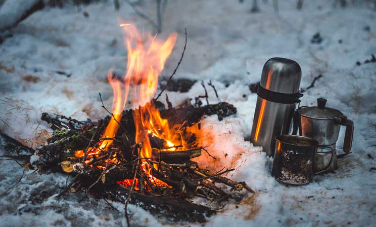 Winter campfire and hot drinks