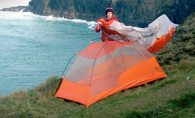 Putting the fly sheet on a tent