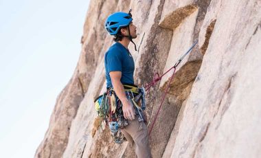 Climber wearing one of the best climbing harnesses