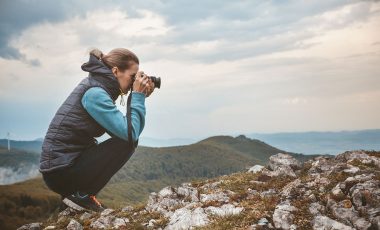 Photographer in mountains