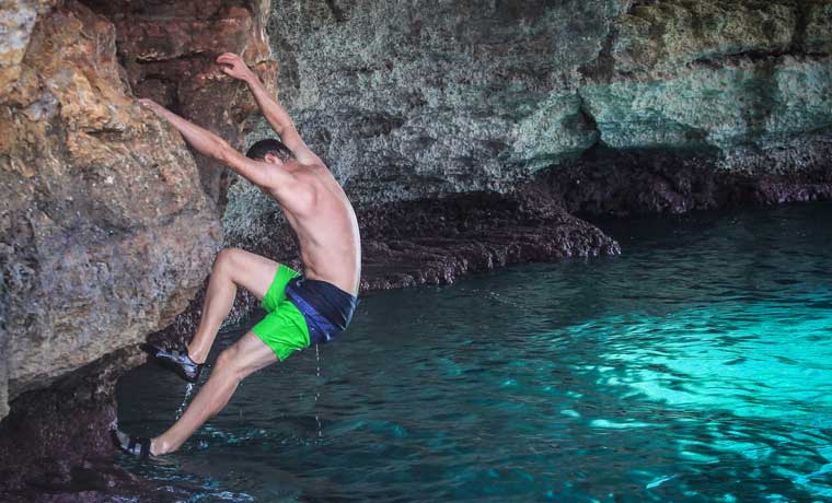 Man climbing out of water