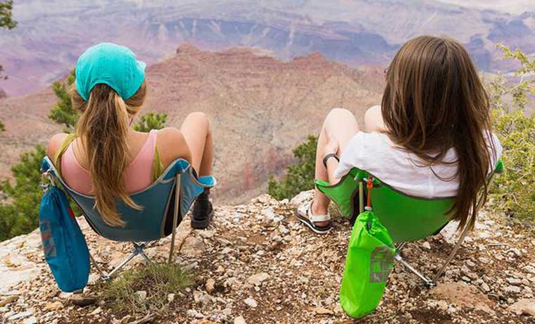 Women sitting on the best Backpacking chairs