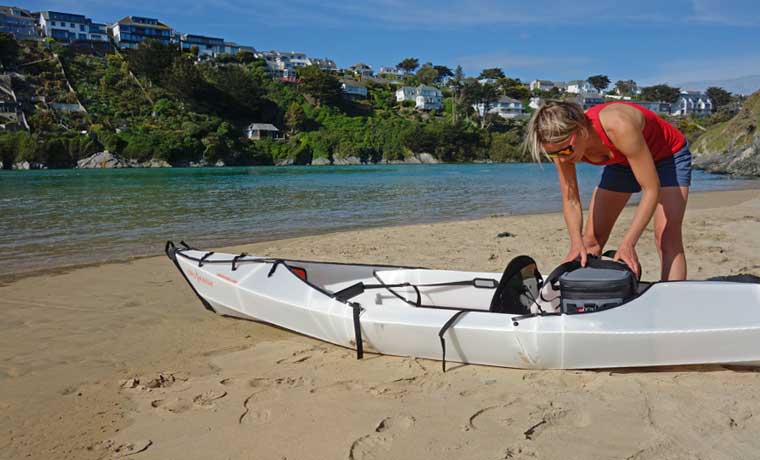 Packing kayak on beach