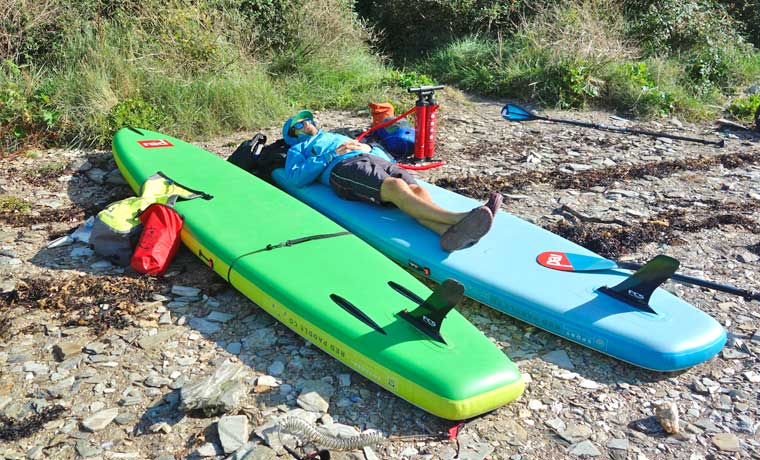 Man sleeping on paddle board