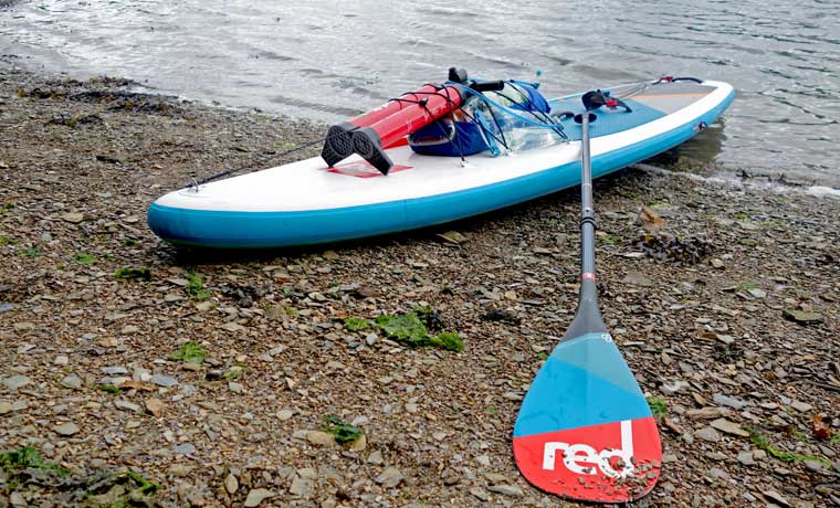 Red Paddle Board on beach