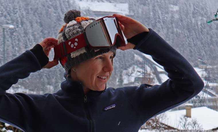 Woman putting goggles on