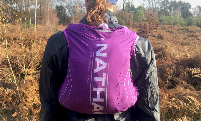 Woman wearing Nathan hydration vest