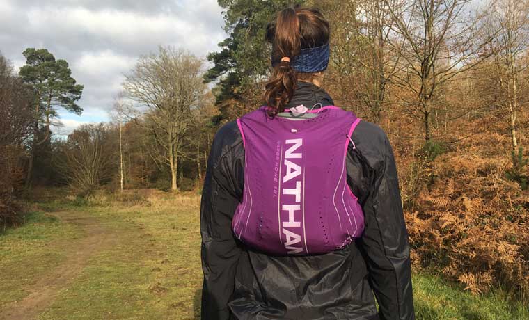 Woman with hydration vest on back
