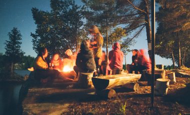 People telling campfire stories