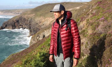 Man wearig Dark Peak jacket on cliff walk