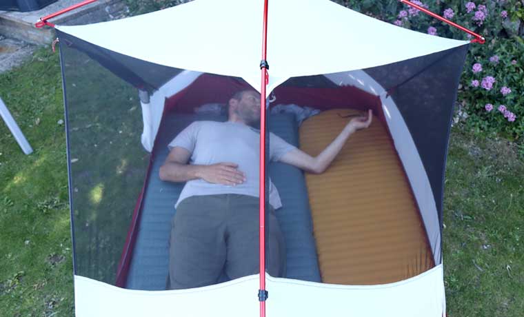 Man lying in tent