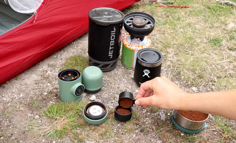 Process of making camping coffee outdoor with metal geyser Stock