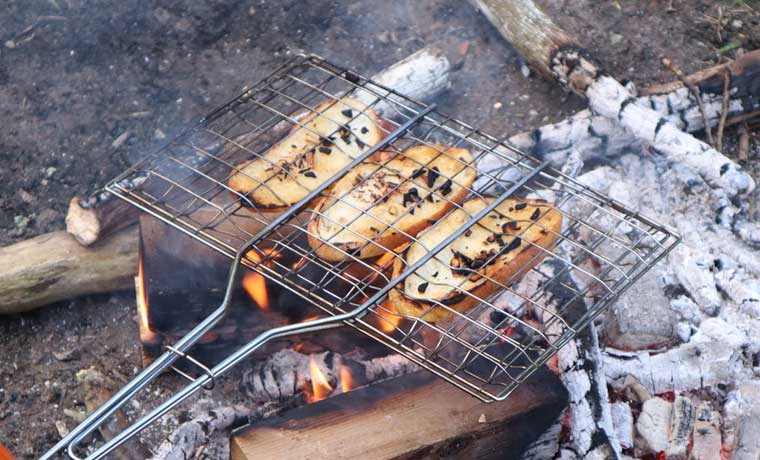 Grill basket over fire