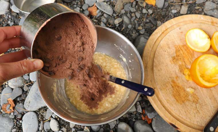 Adding chocolate to cake batter