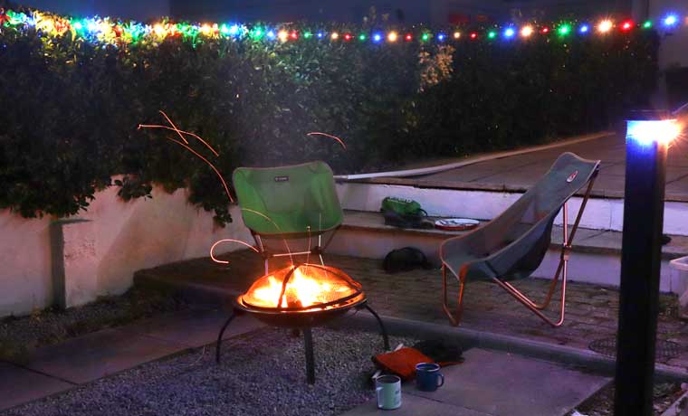 Fire pit and camp chairs on backyard