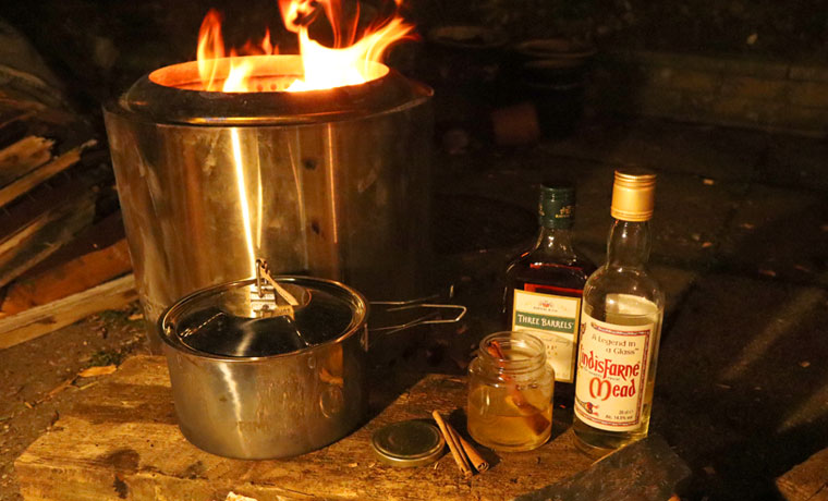 Campfire cocktails at night