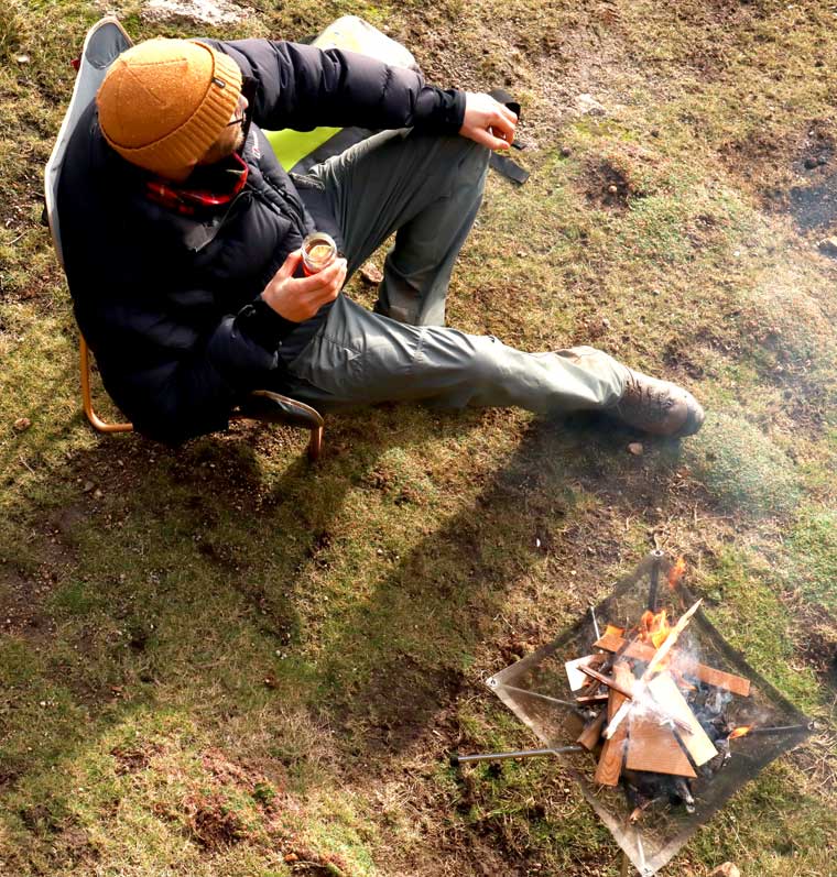 Man sitting with campfire cocktail