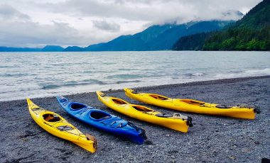 Kayaks on a lake beach