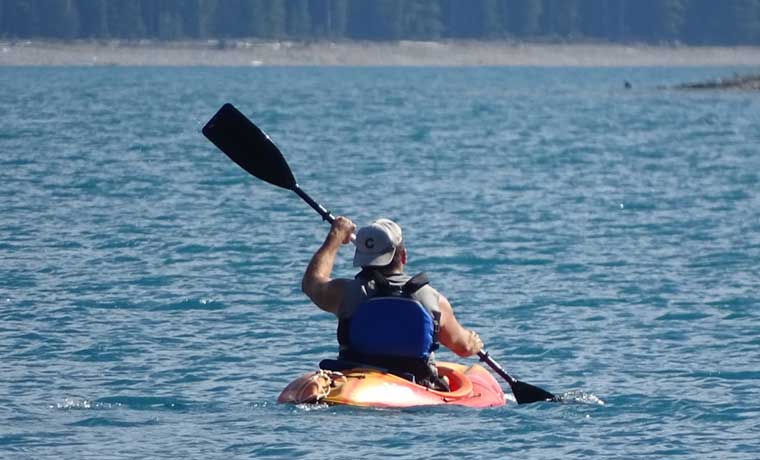 Man paddling a kayak