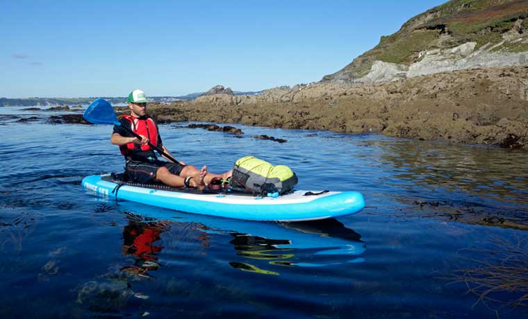 Man paddling sup kayak hybrid