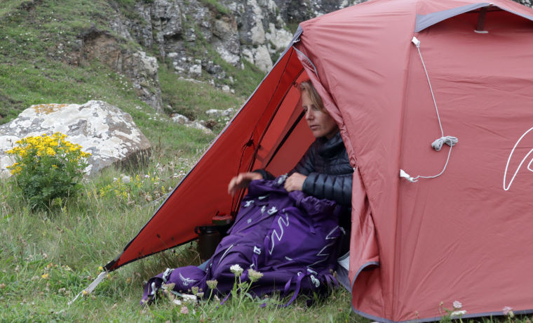 Woman sitting in open tent