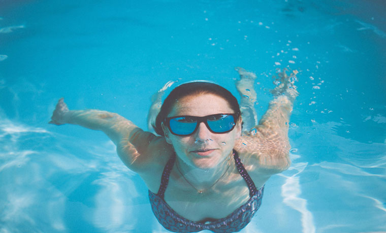 Swimming-in-Rheos-sunglasses