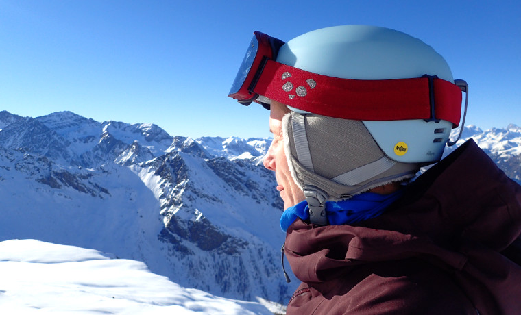 Woman wearing helmet in the mountains