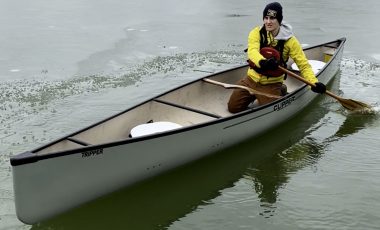 Man demonstrating how to canoe