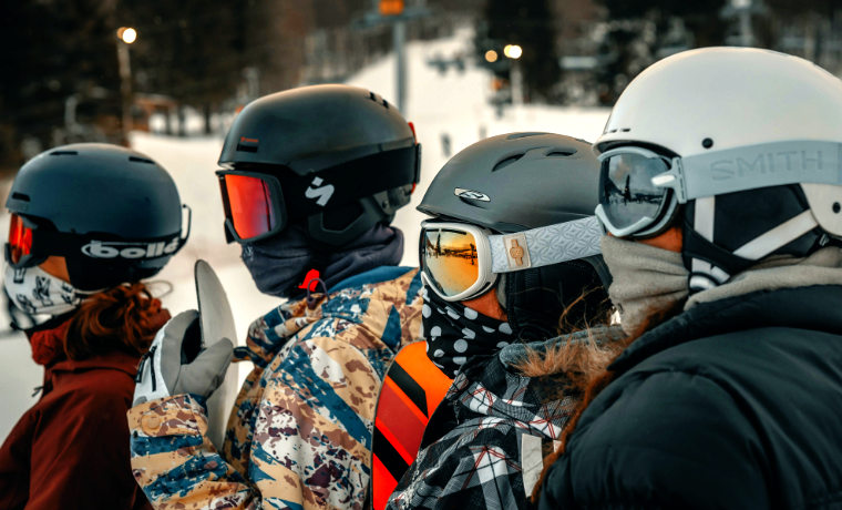Snowboarders in helmets