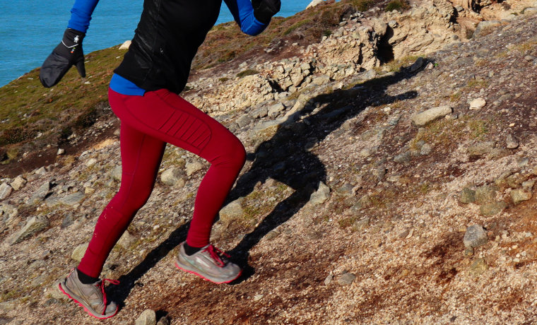 Red running leggings on female runner
