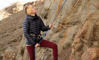 Woman showing how to belay