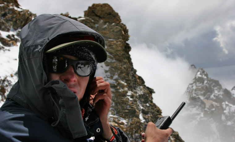 Man with walkie talkie in mountains