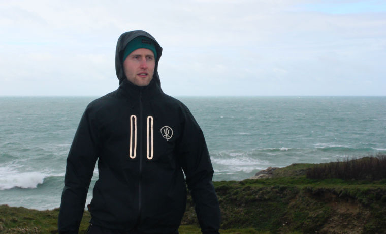 Man standing by the sea in Thrudark jacket