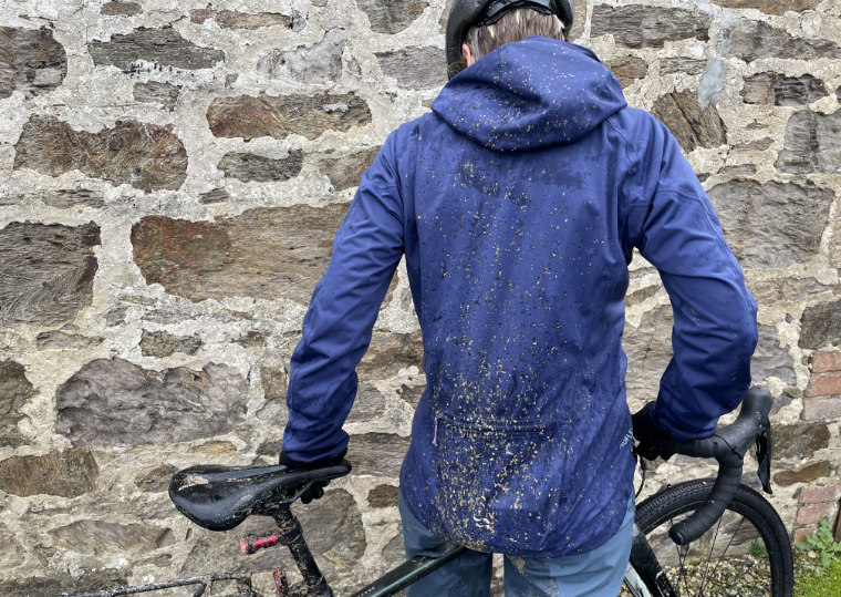 Cyclist with muddy back