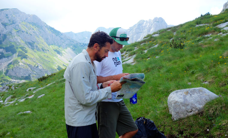 Men map reading in the mountains