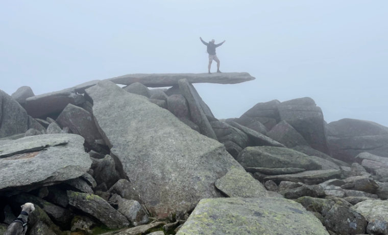 Man on rocks in the mist
