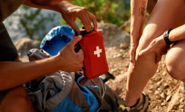 Person giving outdoor first aid