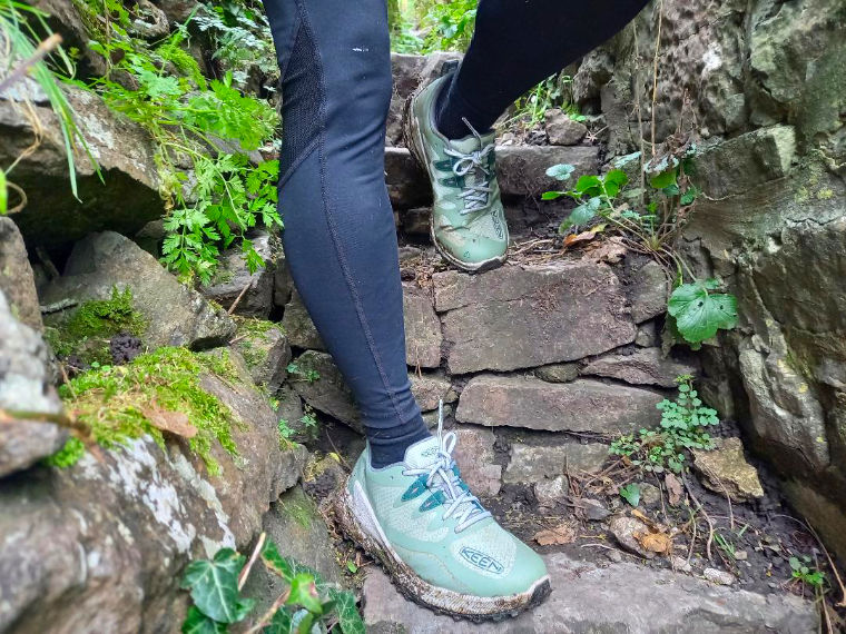 Woman wearing green keen shoes