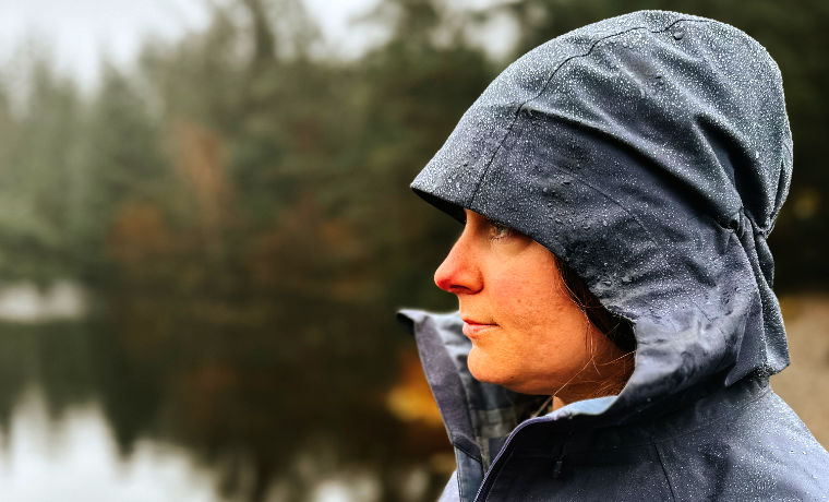 Woman with hood up in rain